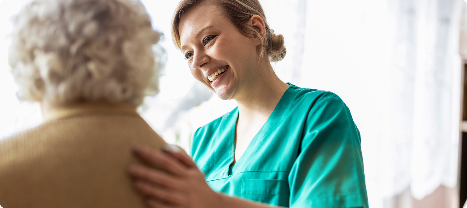 advanced wound therapy nurse caring for an elderly female patient with a wound that has had trouble healing